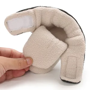Macro view of soft fleece interior lining and velcro strap on baby winter booties