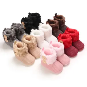 Cozy fleece-lined baby snow boots in various colors with soft soles for infant warmth