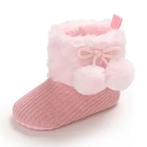 Pink cute infant princess knitted cotton bootie with soft faux fur and pom-pom details