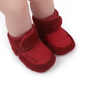 Cozy red infant winter boots with heart embroidery and soft warm fleece lining detail
