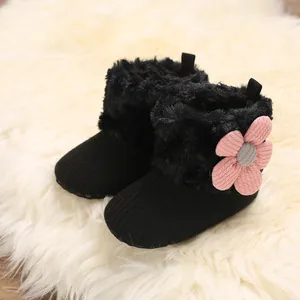 Cozy black baby winter boots with pink flower detail, fleece lining and soft anti-slip soles