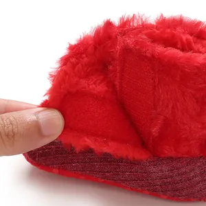 Detail shot showing the red plush fur and soft texture on winter warm baby snow boots
