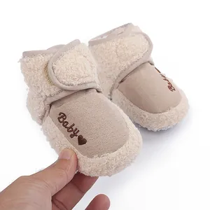 Close-up of soft fleece-lined baby winter boots with 'Baby' heart embroidery detail