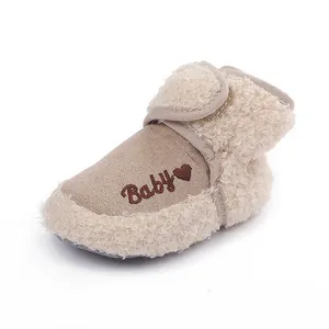 Close-up detail of a soft baby winter boot with fleece lining and Baby embroidery
