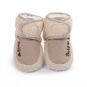 Detailed macro view of soft fleece baby walking shoes with Baby heart embroidery detail