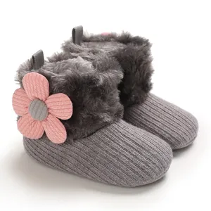 Warm baby winter boots with soft gray faux fur and a pink corduroy flower detail