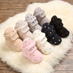 Variety of soft fleece baby winter boots with star patterns shown in different colors