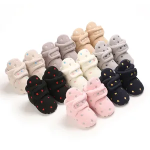 Cozy fleece-lined baby winter boots with soft soles and colorful star patterns