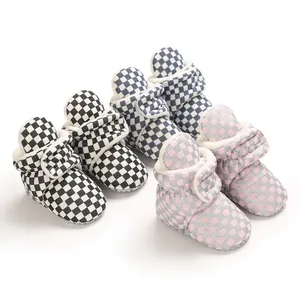 Detailed view of checkerboard warm baby booties with plush lining in multiple colors.
