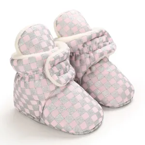 Cozy warm baby winter snow boots with pink checkerboard pattern and soft fleece lining