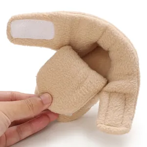 Macro view of soft beige fleece baby boot showing the warm interior and Velcro closure