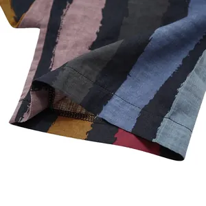 Close-up of linen-textured striped sleeve hem showing double-stitching detail