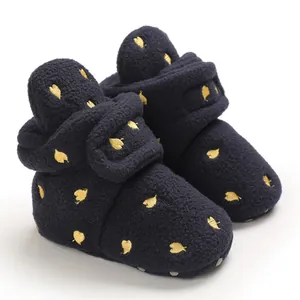Warm navy blue baby fleece booties with gold leaf embroidery for winter protection.