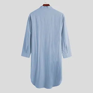 Back view of a light blue long-sleeved men's kaftan robe with a comfortable curved hemline