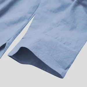 Detail shot showing the cuff and textured fabric of a light blue men's cotton robe