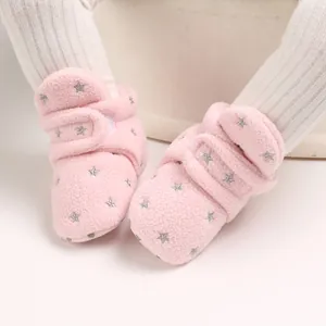 Detailed view of pink fleece baby snow boots with silver star patterns
