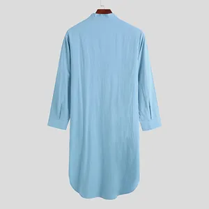 Rear view of light blue long-sleeved men's casual robe shirt in soft solid fabric