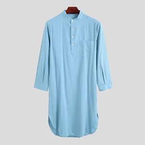Detailed view of light blue long-sleeved men's robe featuring band collar and curved hem