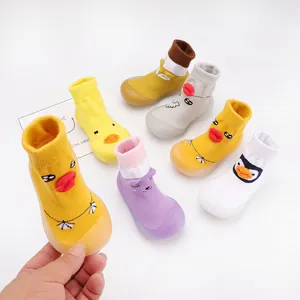 Colorful cartoon baby knit walking shoes with soft anti-slip rubber soles for toddlers.