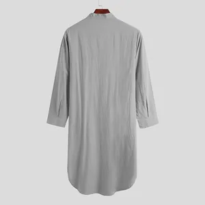 Back view of grey long-sleeved men's ethnic style robe with curved hem details.