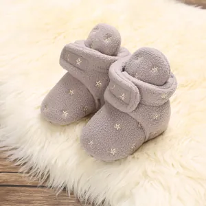 Soft fleece baby winter booties featuring gold star embroidery for infant warmth
