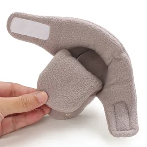 Close-up of a soft-soled fleece baby bootie showing its flexibility and texture.