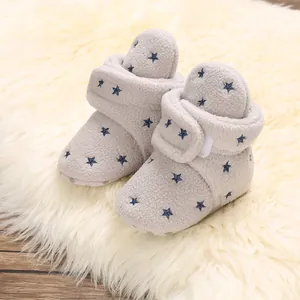 Soft grey fleece baby booties with blue star pattern and warm lining for winter toddlers