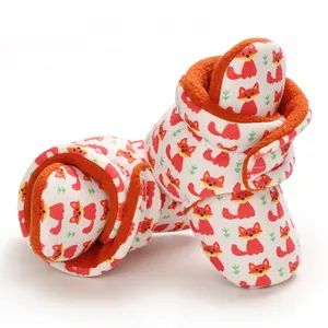 Detailed macro view showing the soft orange fleece lining of baby fox pattern booties