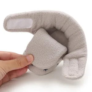 Detail showing soft interior and plush material of grey fleece baby bootie with stars