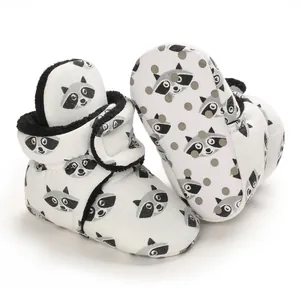 Detailed view of baby cartoon raccoon booties with soft black fleece lining for boys
