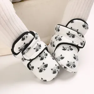 Detailed view of baby raccoon print cotton shoes with secure hook and loop closure