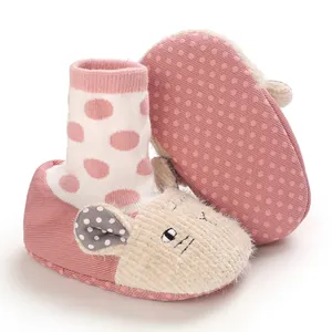Detail of soft pink baby slip-on shoes with cute cartoon animal face and non-slip sole