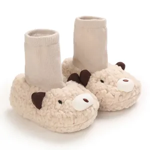 Soft beige fuzzy bear baby booties with ribbed sock top for newborn boys and girls