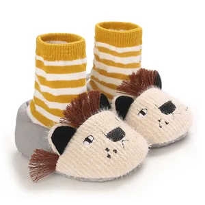 Detailed view of baby soft sole lion shoes with yellow stripes and cute fringe