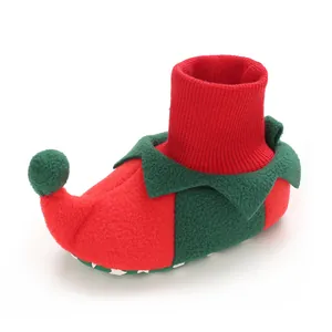 Christmas-themed baby elf booties in soft red and green fleece with knitted cuff