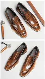 Detailed view of brown square toe patent leather loafers with embossed checkered pattern