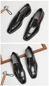 Detail of men's black patent leather loafers featuring embossed checkered patterns.