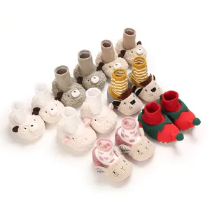 Warm cartoon baby walking shoes with soft soles and cute animal designs for winter