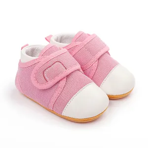 Close-up of pink baby walking shoes with anti-slip rubber sole and velcro strap