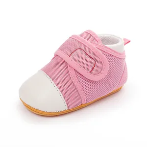 Close-up detail of pink breathable mesh baby walking shoes with rubber sole