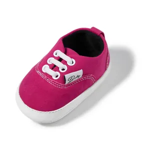 Zapatillas clásicas de lona magenta para bebé con suela de goma blanca antideslizante