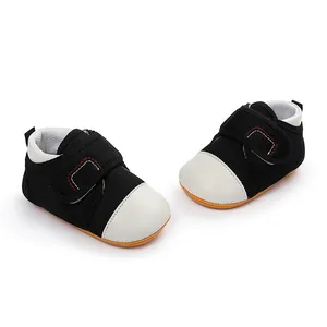 Close-up of baby walking shoes with black mesh upper and non-slip rubber sole