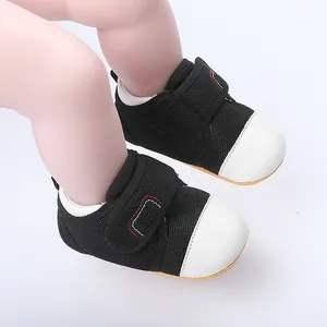 Detailed view of breathable baby walking shoes with non-slip rubber soles and velcro straps