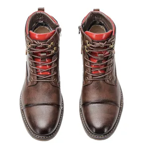 Professional top-view of men's brown leather work boots with red accents and laces.