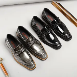 Classic men's patent leather loafers with embossed lattice pattern for business formal wear.