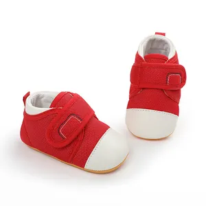 Close-up of breathable red and white mesh baby pre-walker shoes with non-slip sole