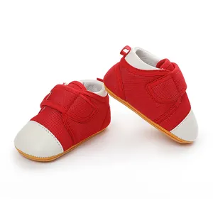 Red breathable mesh baby walker shoes with non-slip rubber soles and white toe caps