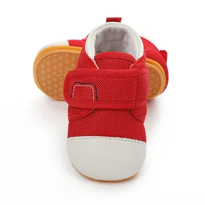 Close-up detail of breathable red mesh baby walking shoes with non-slip rubber sole