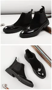 Λεπτομερής όψη μαύρων μποτών Chelsea brogue με λουστρίνι δέρμα και χοντρή σόλα από καουτσούκ.