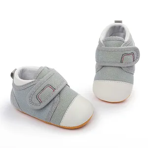 Detailed macro view of breathable mesh baby walking shoes with non-slip rubber soles
